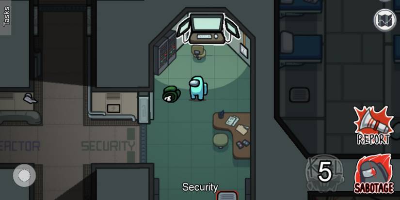 A dead body laying in The Skeld security room in Among Us