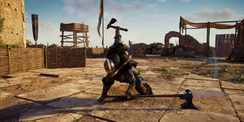 eivor wielding bearded axxe in main hand and dane axe in secondary hand.