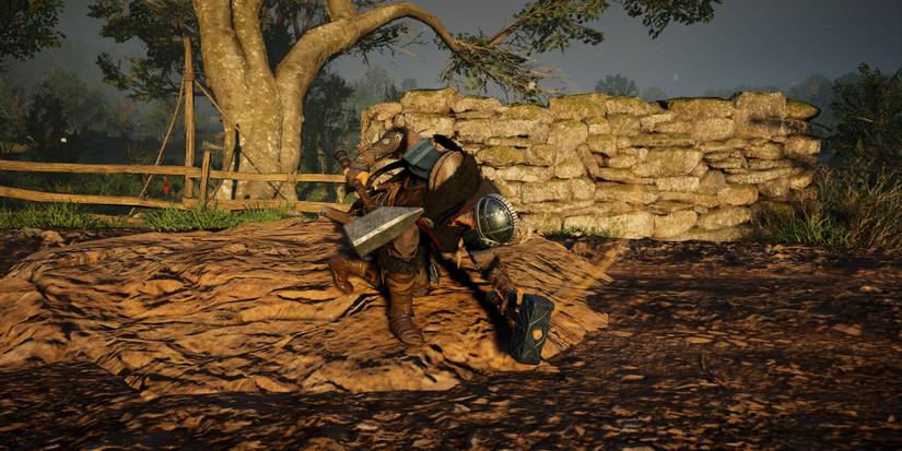 eivor using a hammer in each hand.