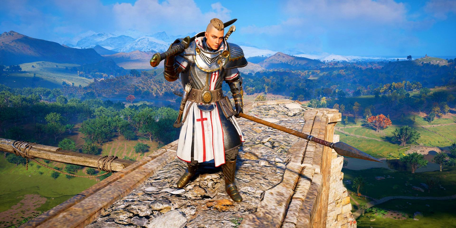 player holding a great sword and a spear on a ruin.