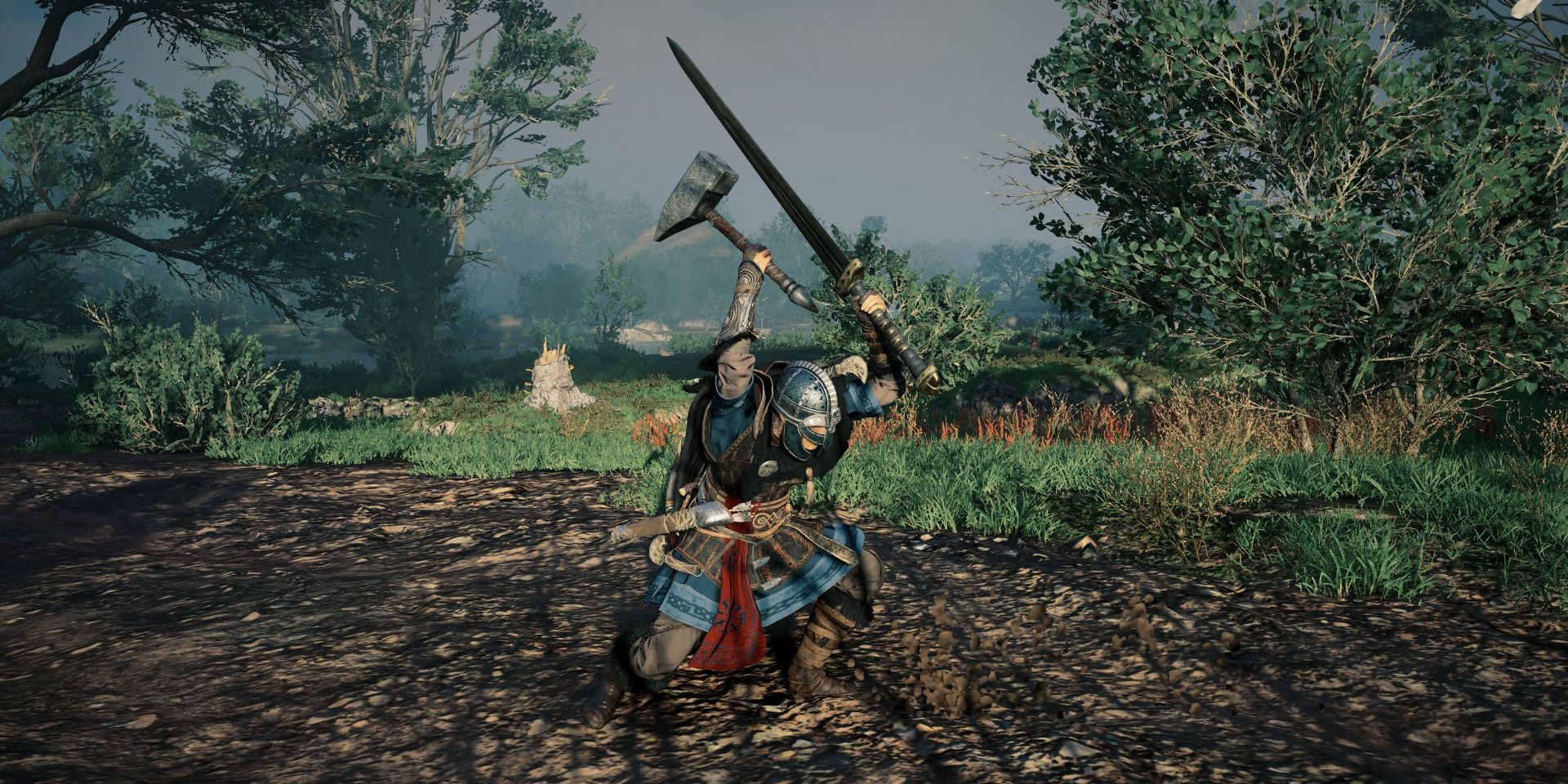 player wielding a hammer in main hand and great sword in secondary hand.