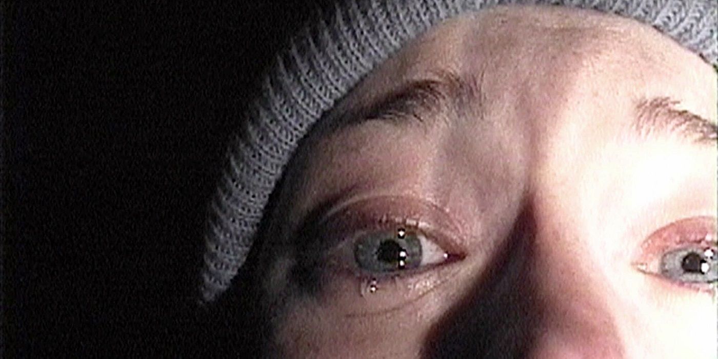 Film student Heather stares terrified into her camera in the poster for the found-footage horror film The Blair Witch Project.