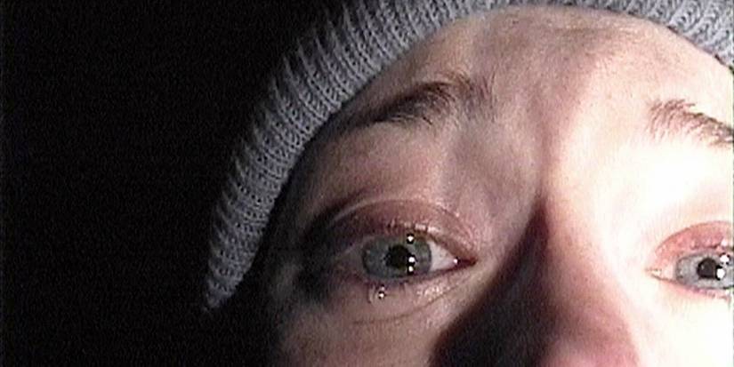 Film student Heather stares terrified into her camera in the poster for the found-footage horror film The Blair Witch Project.