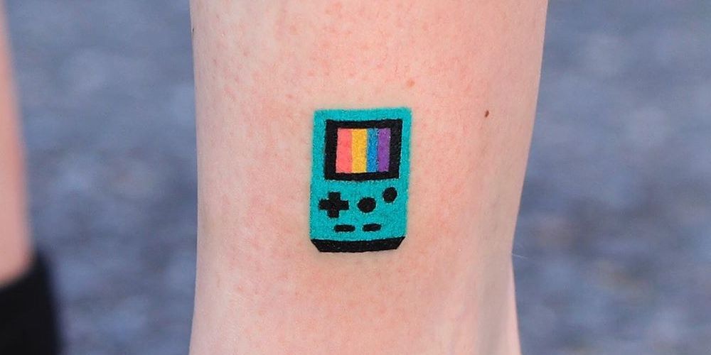 Little blue Gameboy tattoo on shin.