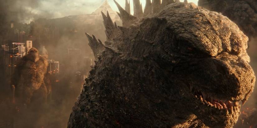 Godzilla in the foreground, with Kong standing in the background