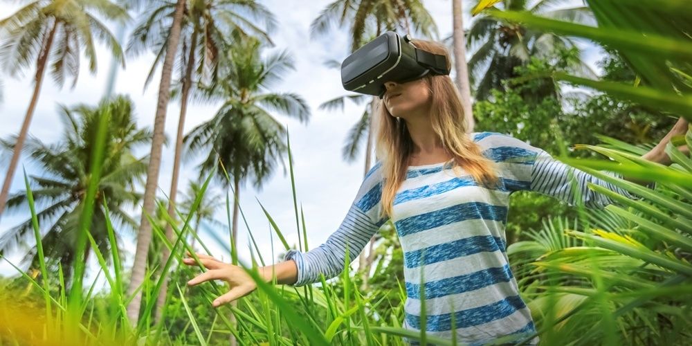 Woman in VR headset in the wilderness