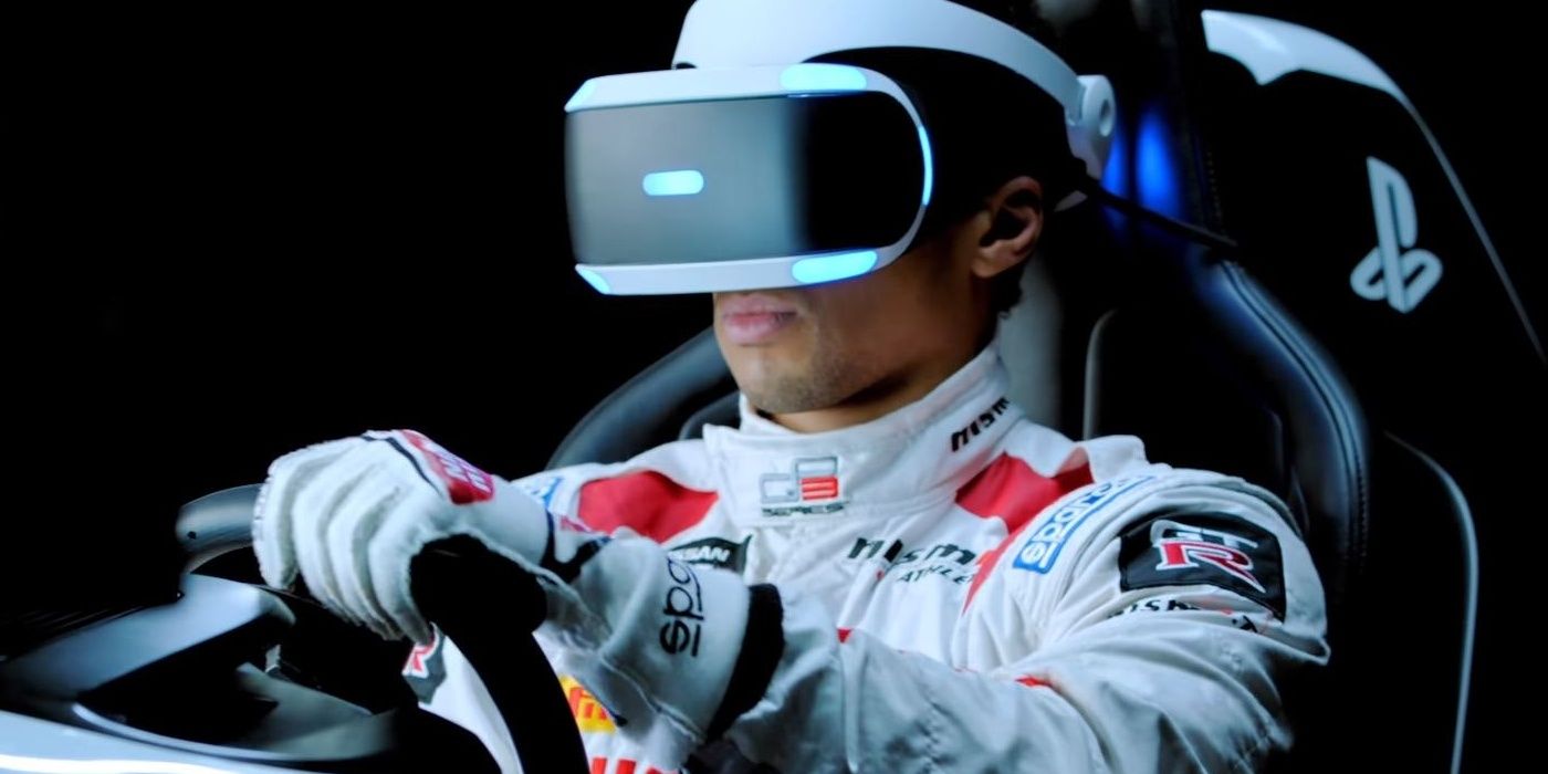 Man in racing gear wears VR headset