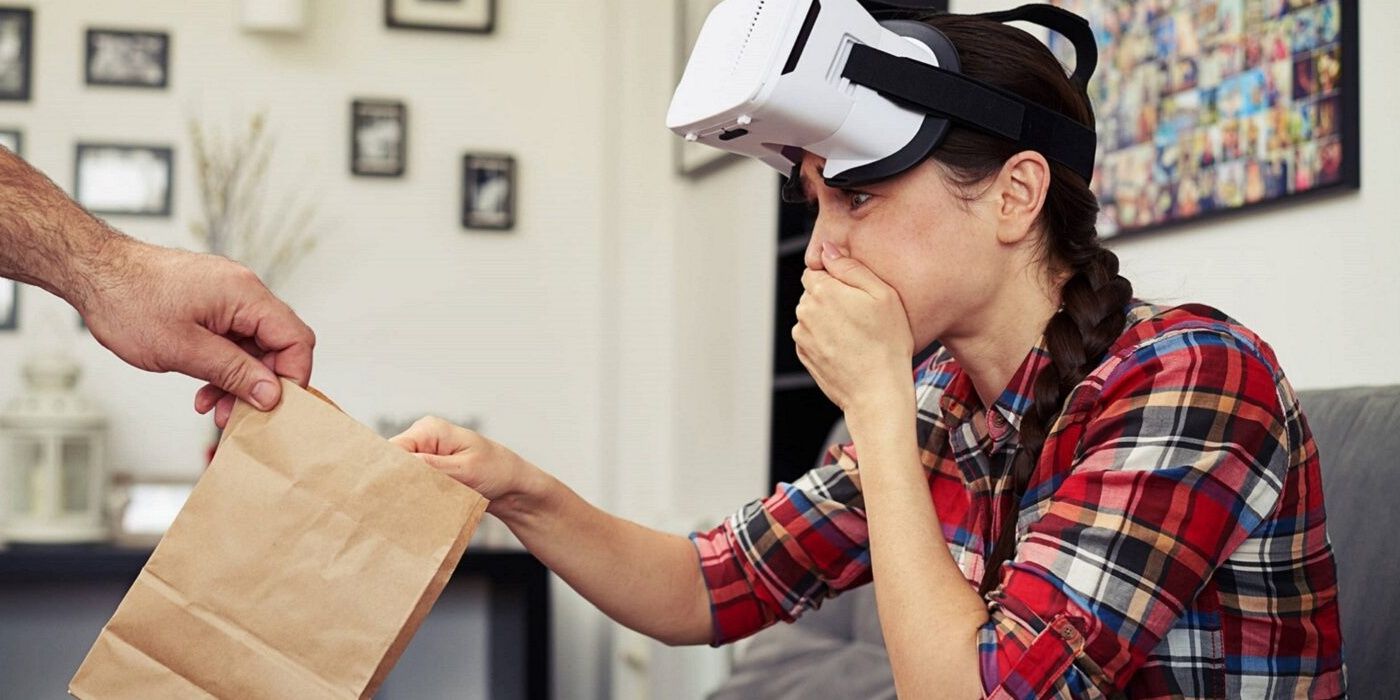 Woman is sick with VR headset