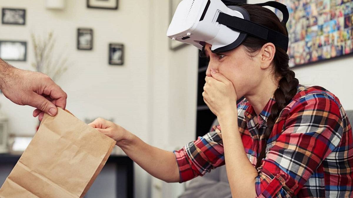 Woman is sick with VR headset