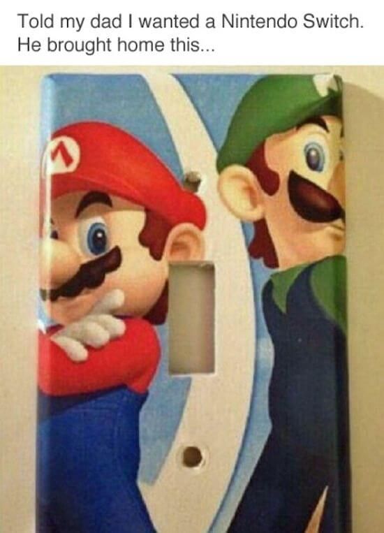 a light switch plate with mario and luigi on it.