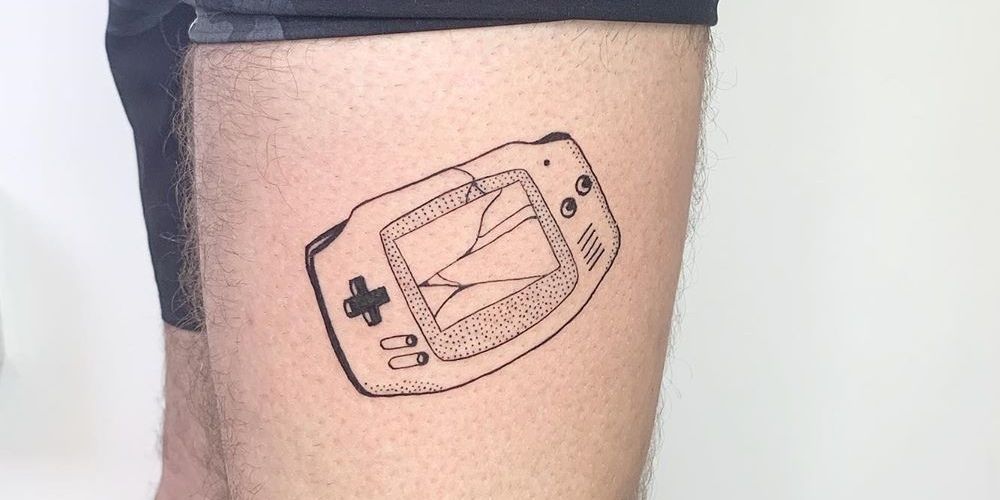 Gameboy line tattoo on leg.