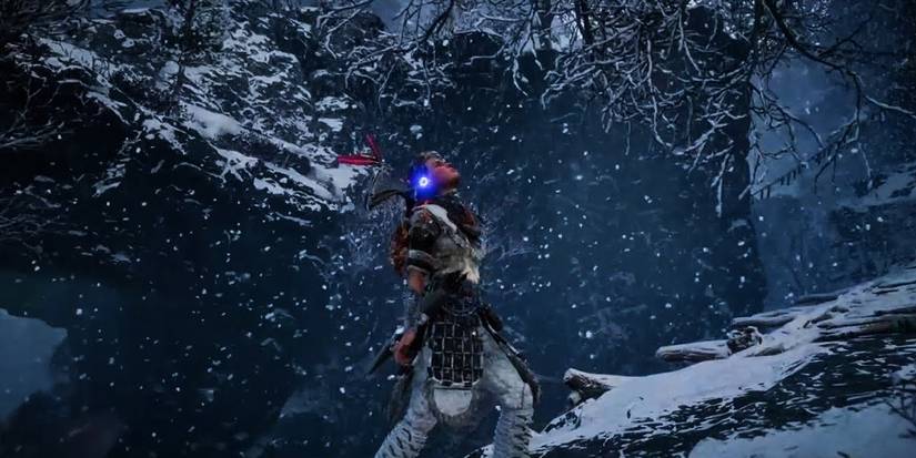 Alloy climbing mountain in snow.