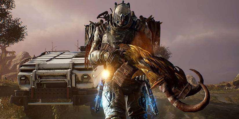 outrider standing in front of convoy vehicle