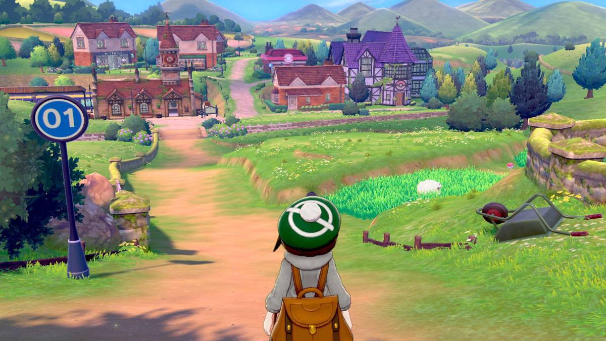 pokemon-sword-and-shield-player-on-hill-overlooking-town