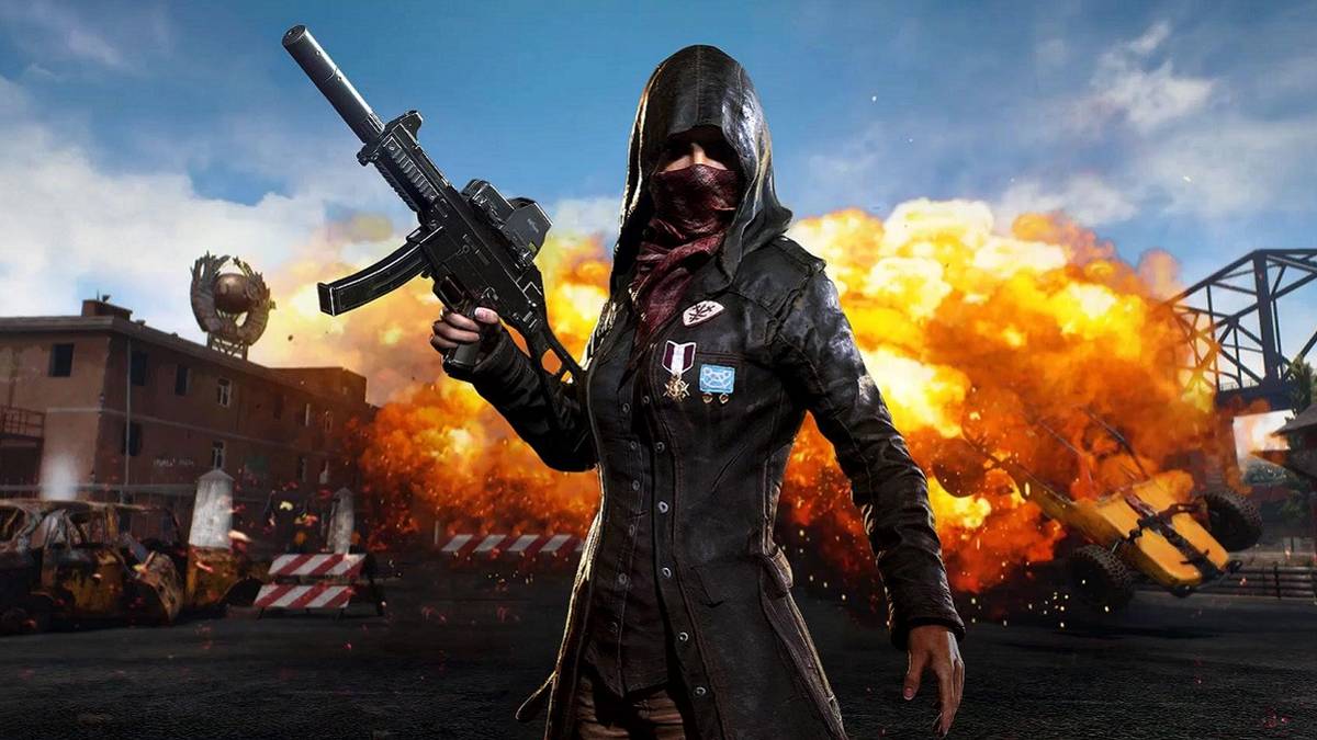 PUBG screenshot showing female character in the foreground as something explodes behind her.