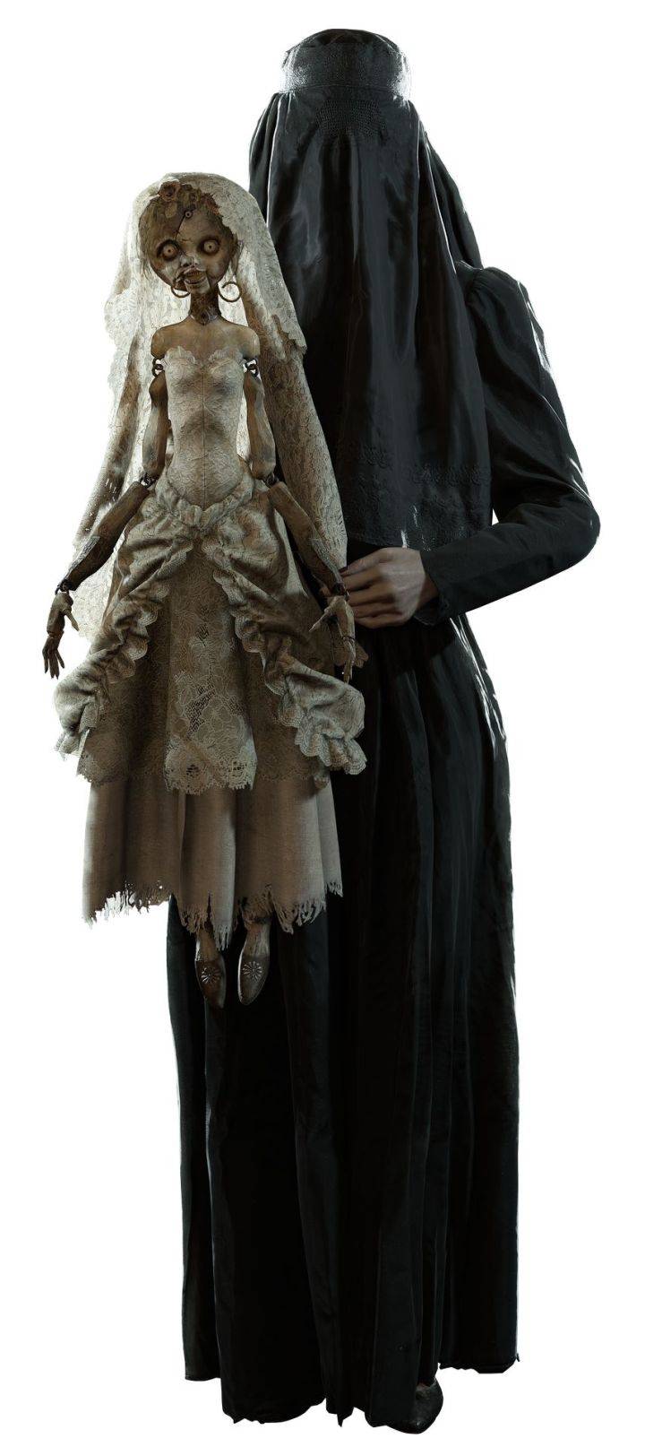 Donna Beneviento holds her wooden bride puppet.