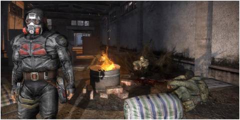 Stalkers sitting around a campfire