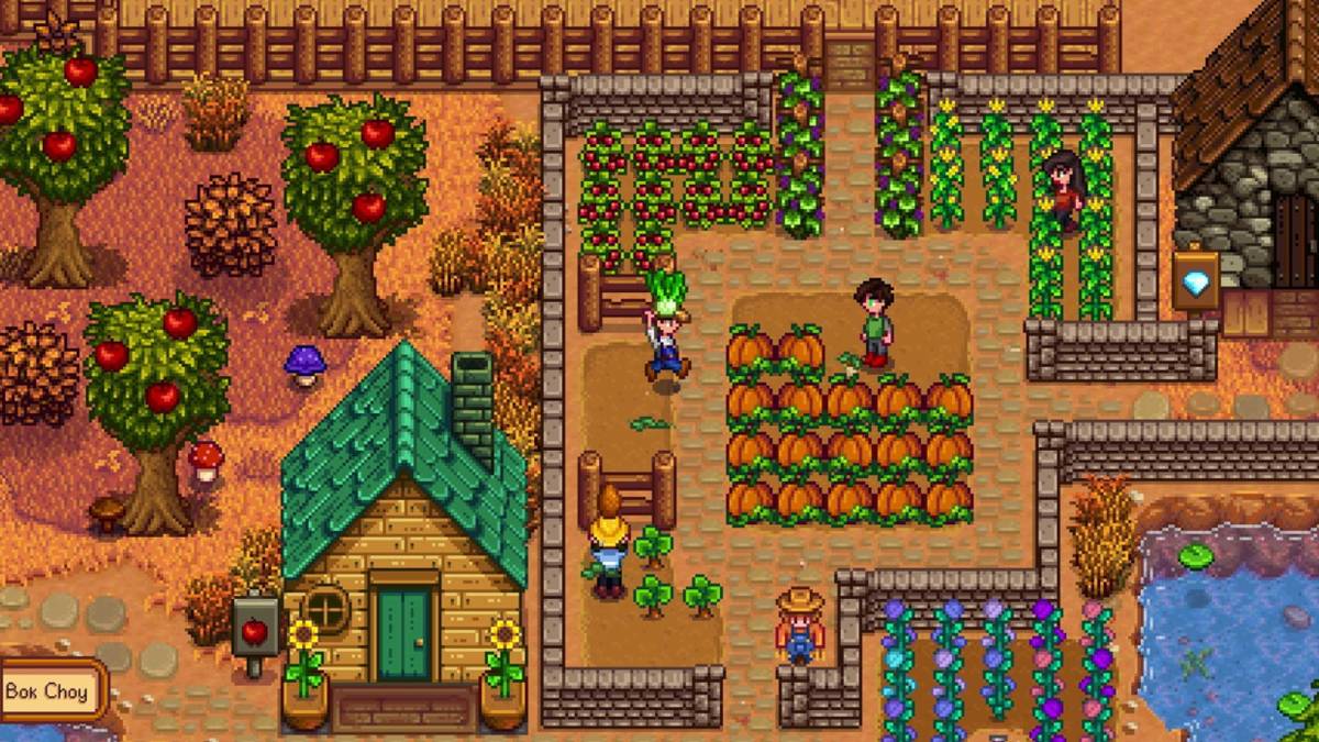 stardew valley multiplayer farm during autumn with fruit trees and colorful houses