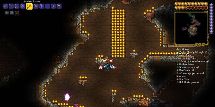 player setting up a torch god arena in an open underground area.