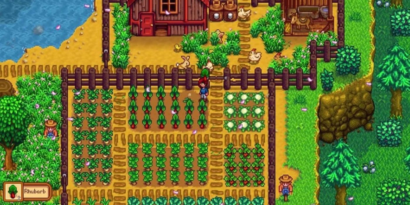 stardew tomato farm with organized crops fenced off from barn