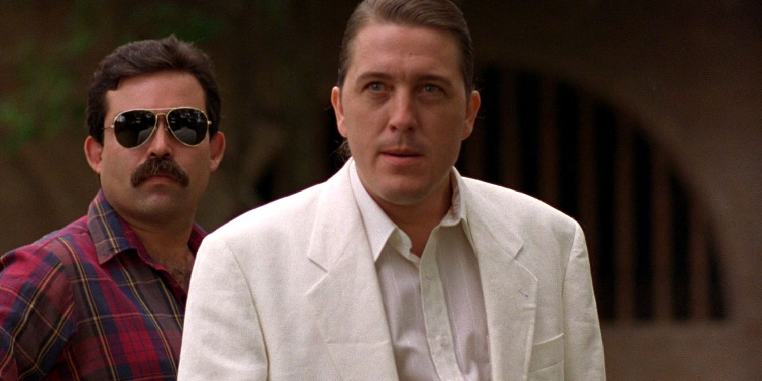 Peter Marquardt as the drug lord Moco, standing with a henchman, in El Mariachi