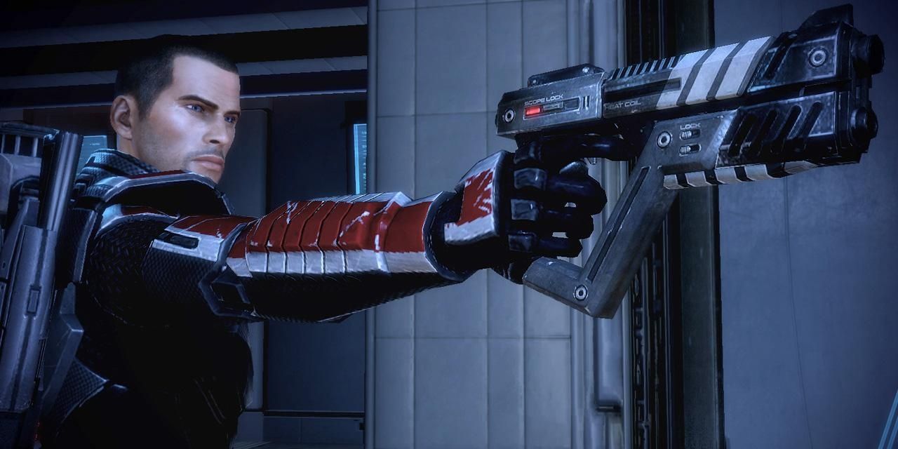Shepard Holding A M-5 Phalanx From Mass Effect 2