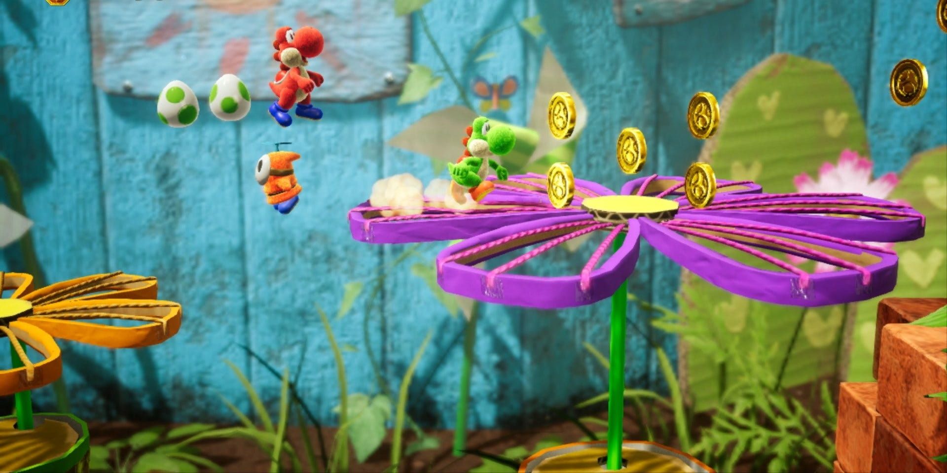Yoshi and Red Yoshi in one of the early levels in Yoshi's Crafted World