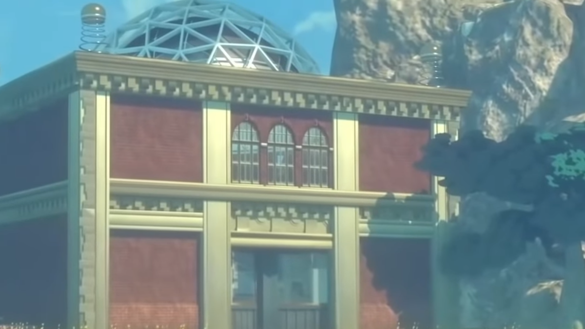 A red brick Building sitting beside a mountain