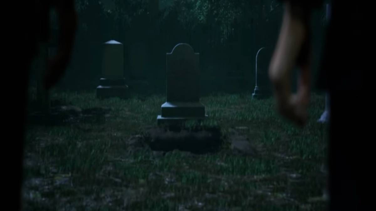 At Selene's funteral, mourners look at her headstone during a rainy day
