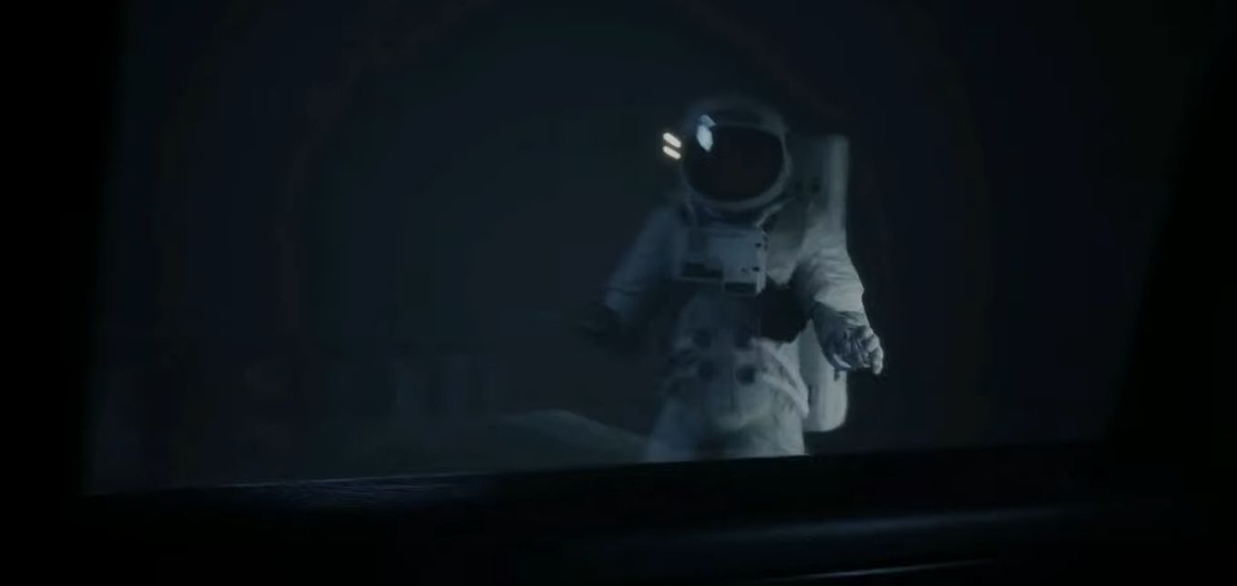 Someone in a vintage space suit before they are hit by a car.