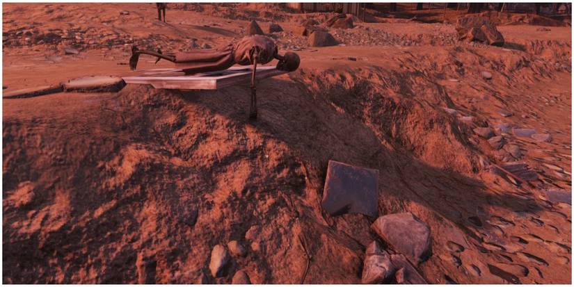 A person reaching for a skeleton arm