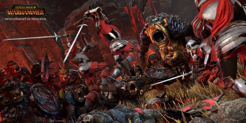 Orcs Battle Brettonian Soldiers Wielding Zweihanders.