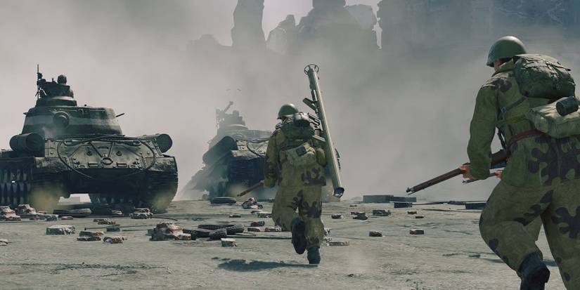 soldiers follow tank into battle