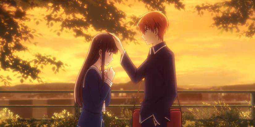 Kyo patting Tohru's head.