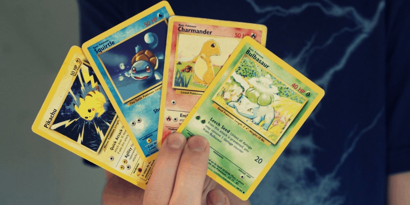 pokemon cards in hand