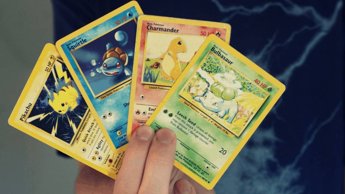pokemon cards in hand