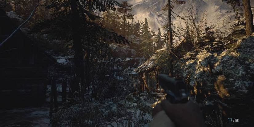 forest scene with cabins tucked in resident evil village