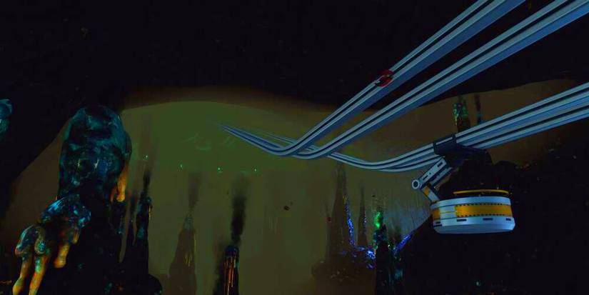 biome with human-made rails leading into a dank cave.