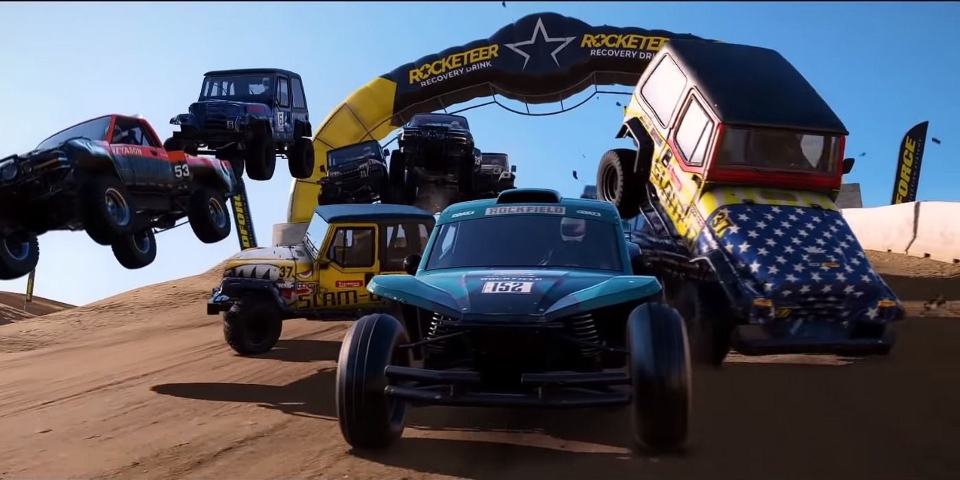 wreckfest cars racing on dirt road course