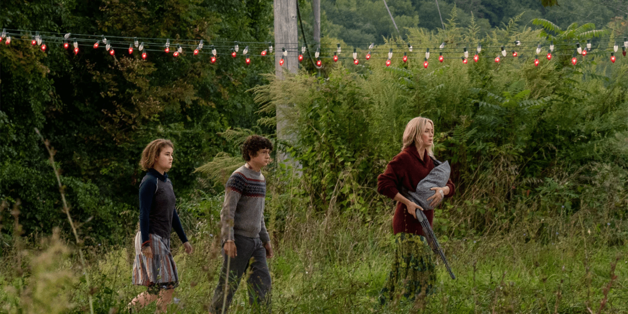 Evelyn and kids walking through field A Quiet Place 2