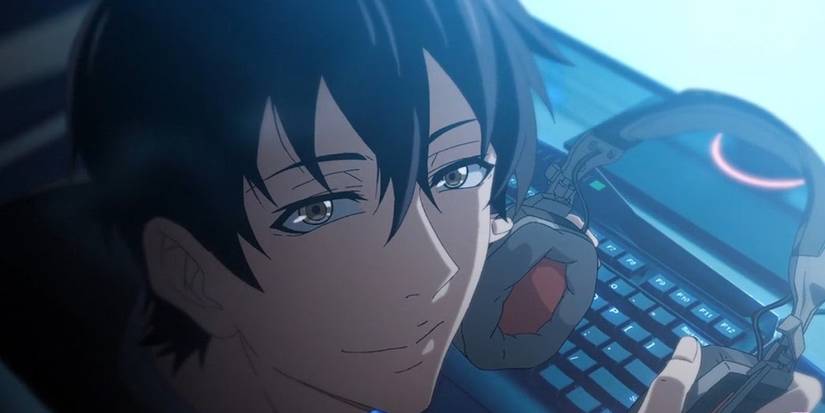 A young man looks up from his computer holding headphones in The King's Avatar