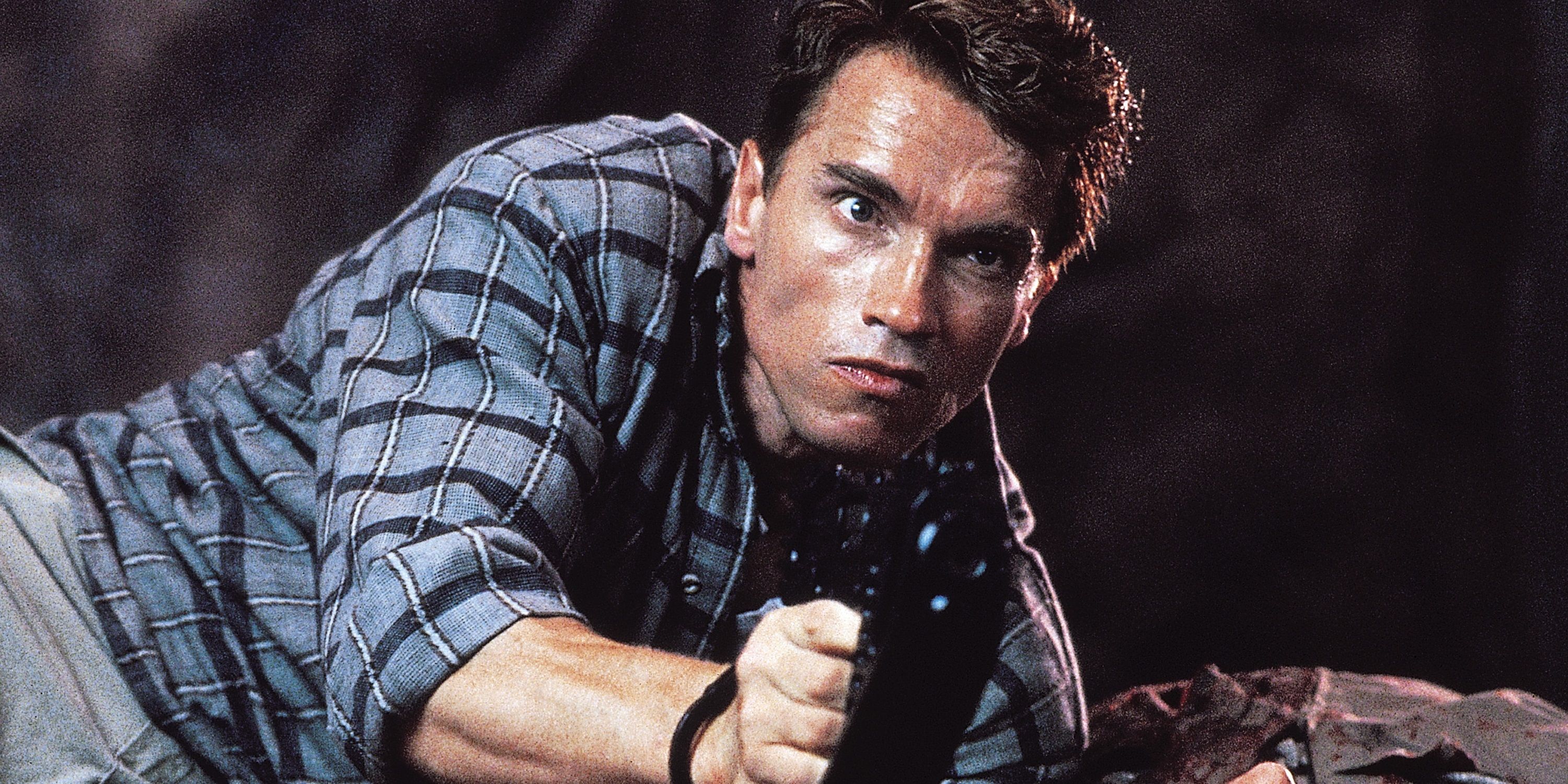 Arnold Schwarzenegger with a gun in Total Recall