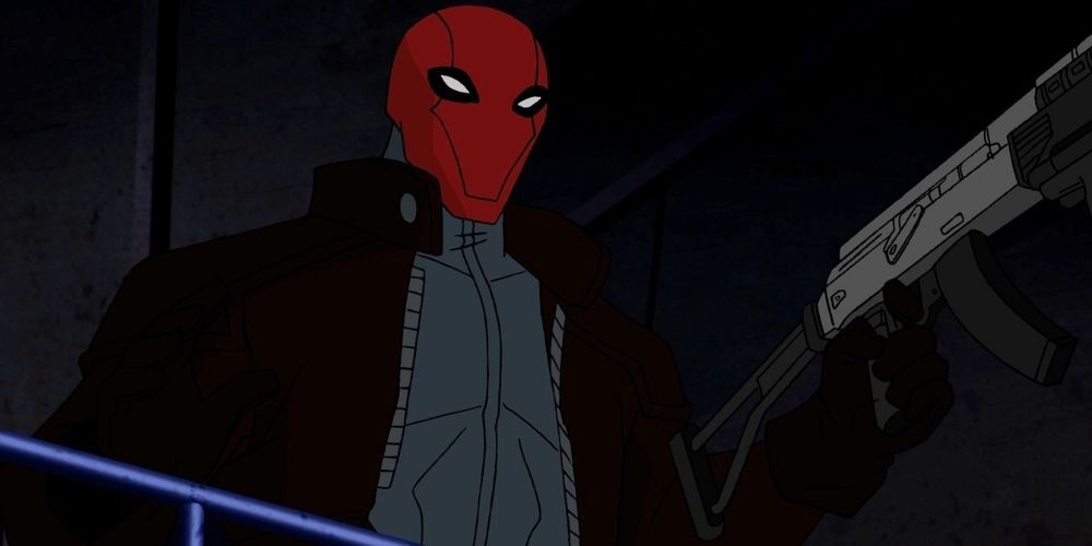 The Red Hood Pointing His Assault Rifle In Batman: Under The Red Hood