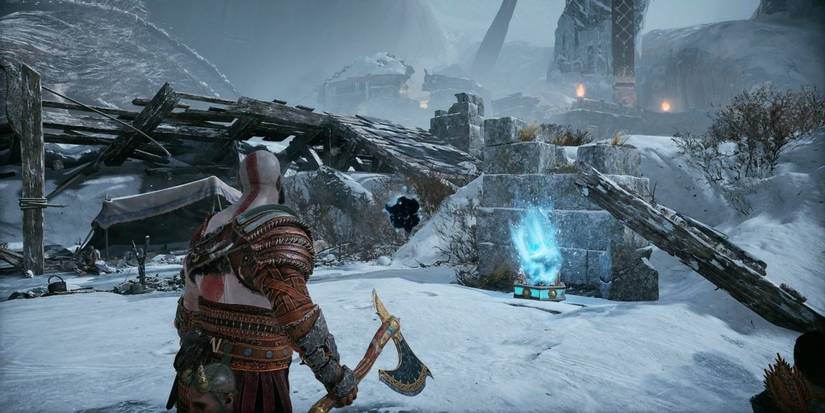 Kratos in front of the realm tear at Thamurs corpse in God of War