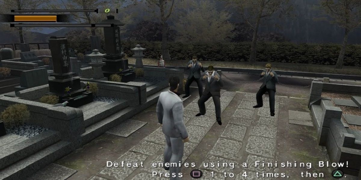 Kazuma Kiryu about to fight a group of enemies in a cemetery in Yakuza 2