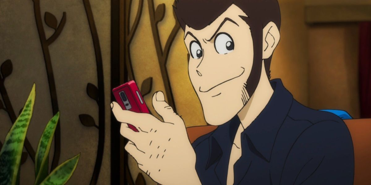 Lupin The Third has a mischevious smile and a phone in his hand