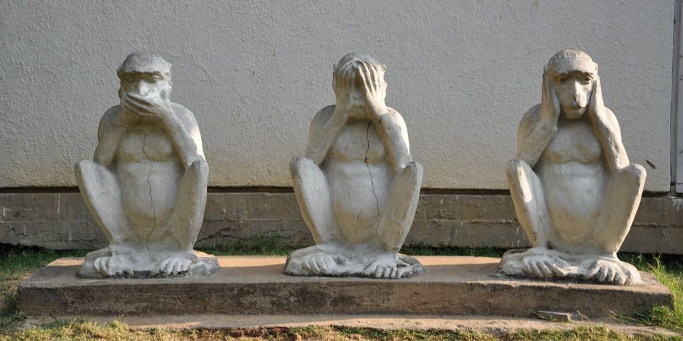Ghandi's Statues of the Three Monkeys doing the see no evil speak no evil hear no evil pose