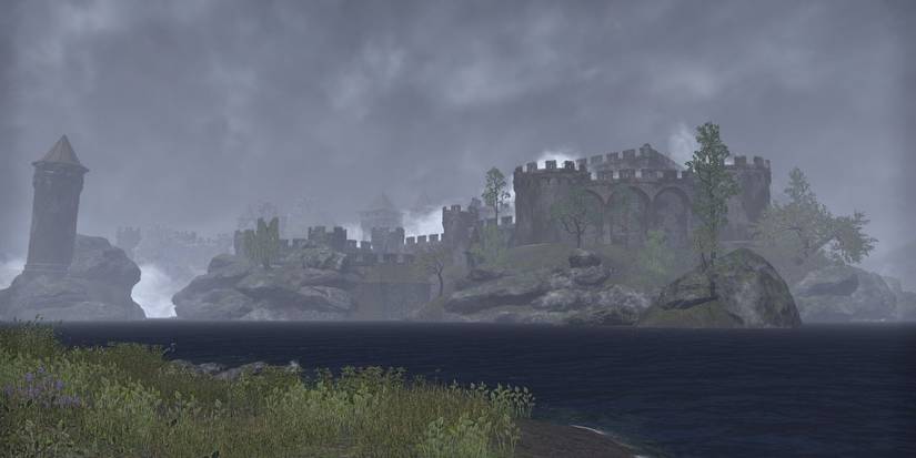 misty castle across lake