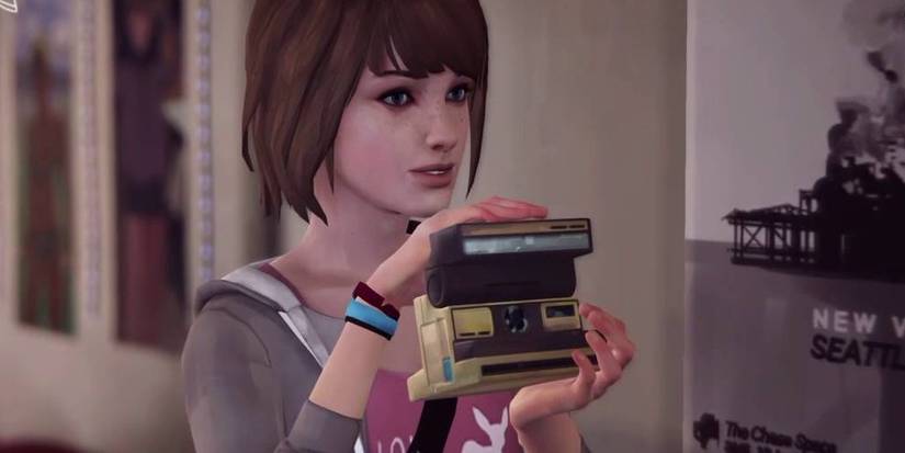 Max holding her camera.