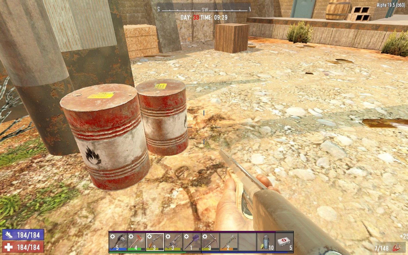 Screenshot from 7 Days to Die showing two explosive red barrels.